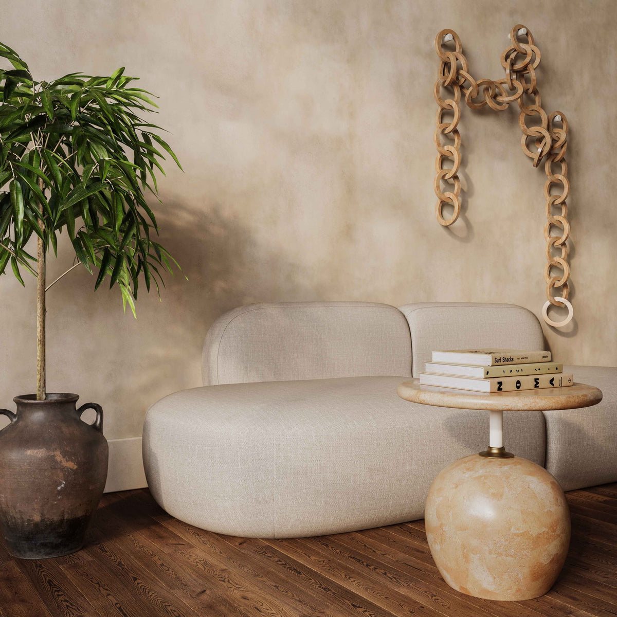 Beige faux marble round side table with short rose-gold stem and globe base