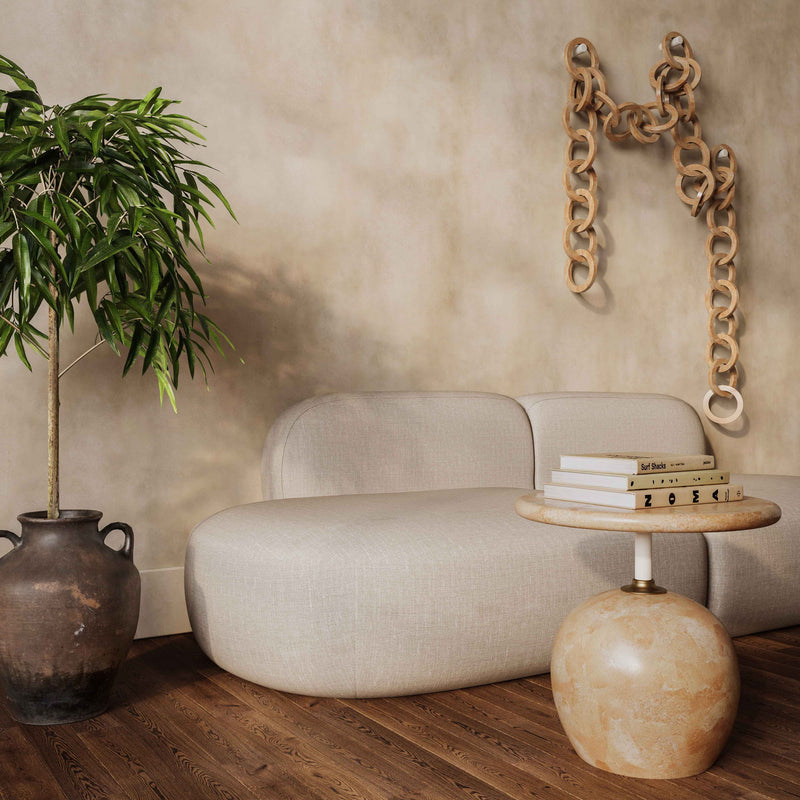 Beige faux marble round side table with short rose-gold stem and globe base