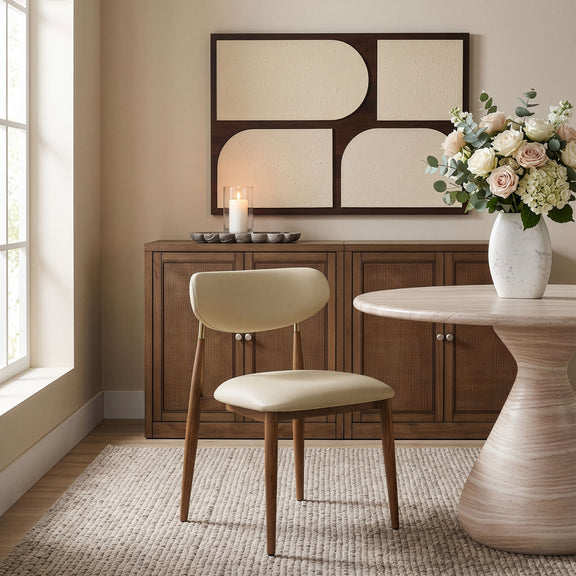 Beige upholstered dining side chair with curved back and walnut legs