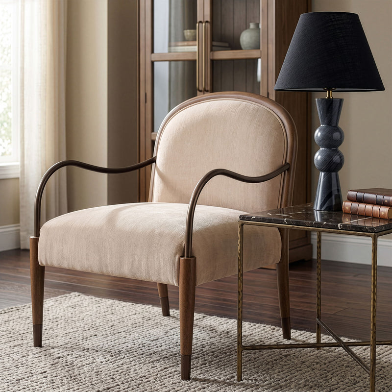 Beige fabric upholstered accent chair with curved armrests and arched back