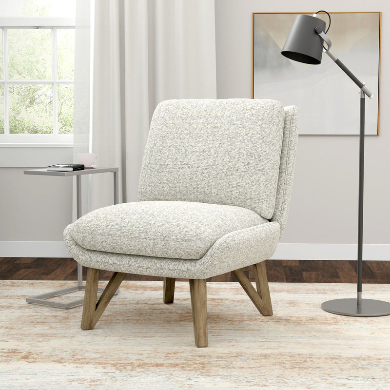 White speckled armless accent chair with padded back and seat, and angled wooden legs.