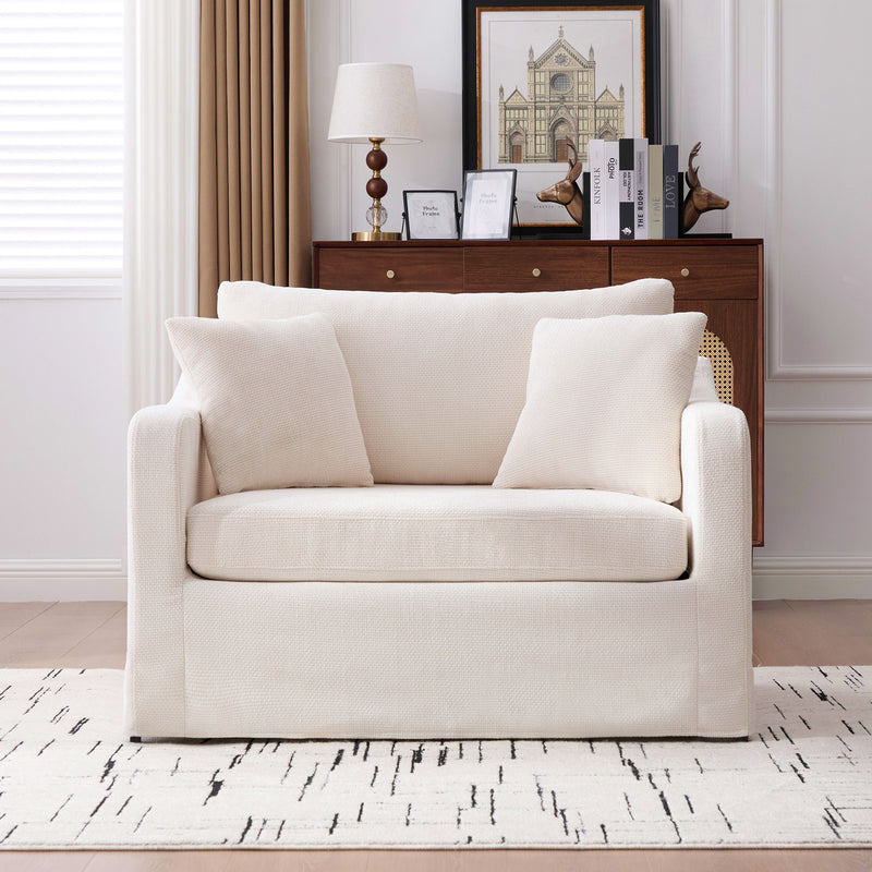 Cream fabric accent chair with 2 bolster pillows, track arms, wide seat