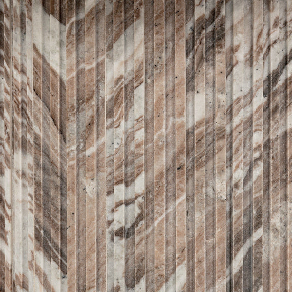 Close-up of cylindrical marble base with vertical texture and warm gray streaks