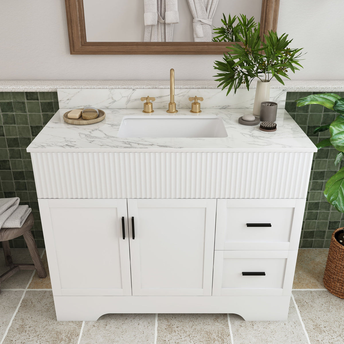 White bathroom vanity with fluted cabinet front, sink basin, and gold faucet set on top