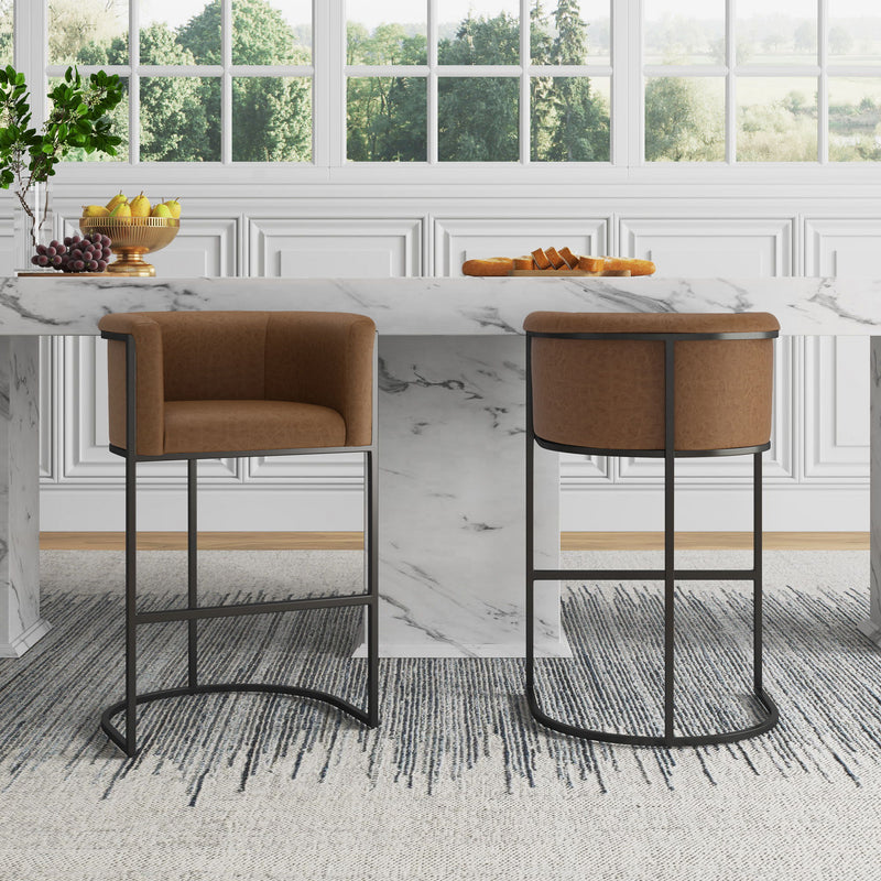 Set of two brown upholstered barstools with black metal frames and curved footrests