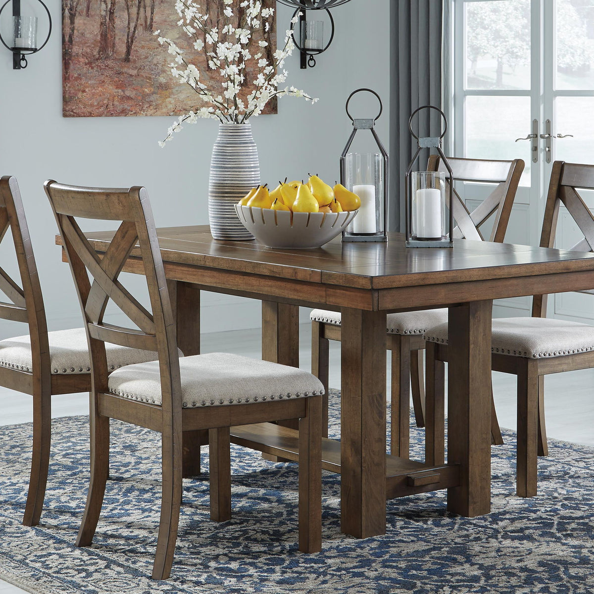 Rectangular dining extension table with dark gray-brown finish and four upholstered chairs