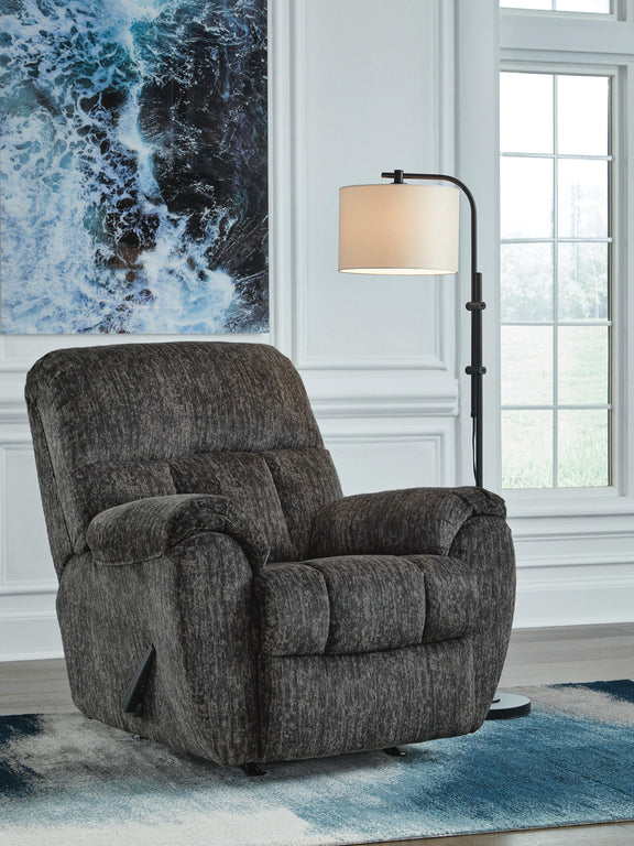 Dark gray rocker recliner chair with padded arms and cushioned backrest