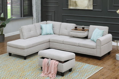 Light gray sectional sofa with left-facing chaise and matching ottoman, blue accent pillows