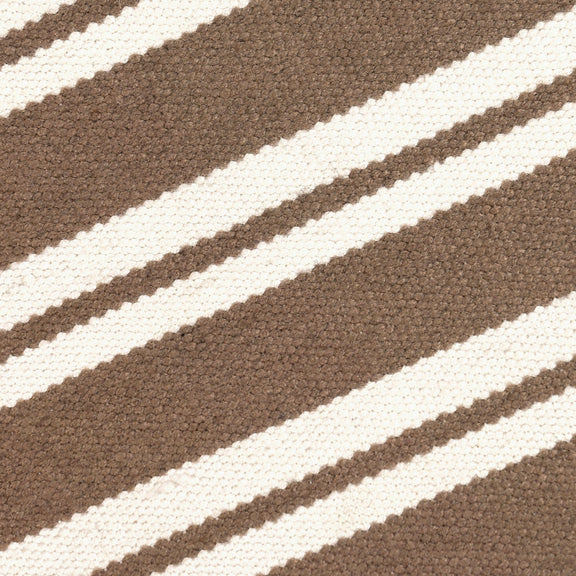 Close-up of coconut brown rug with white horizontal stripe weaving texture