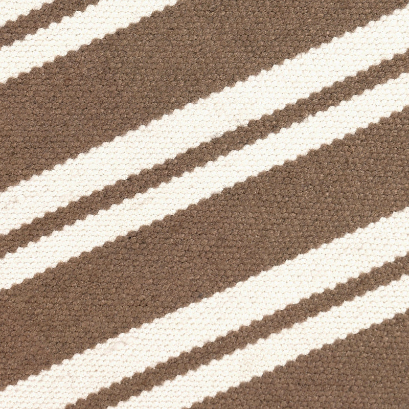 Close-up of coconut brown rug with white horizontal stripe weaving texture