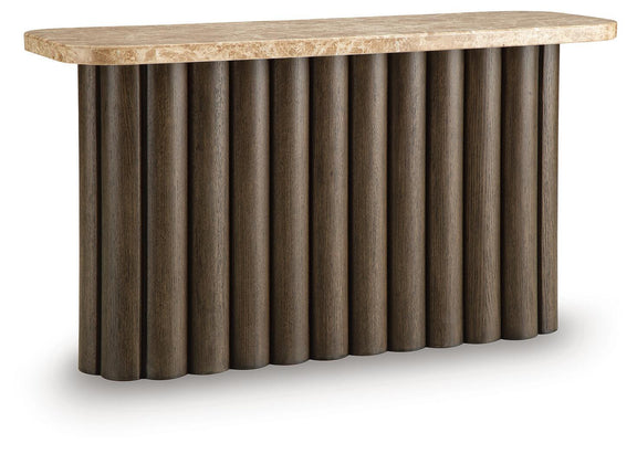 Rectangular table with speckled light stone top and dark fluted pedestal sides