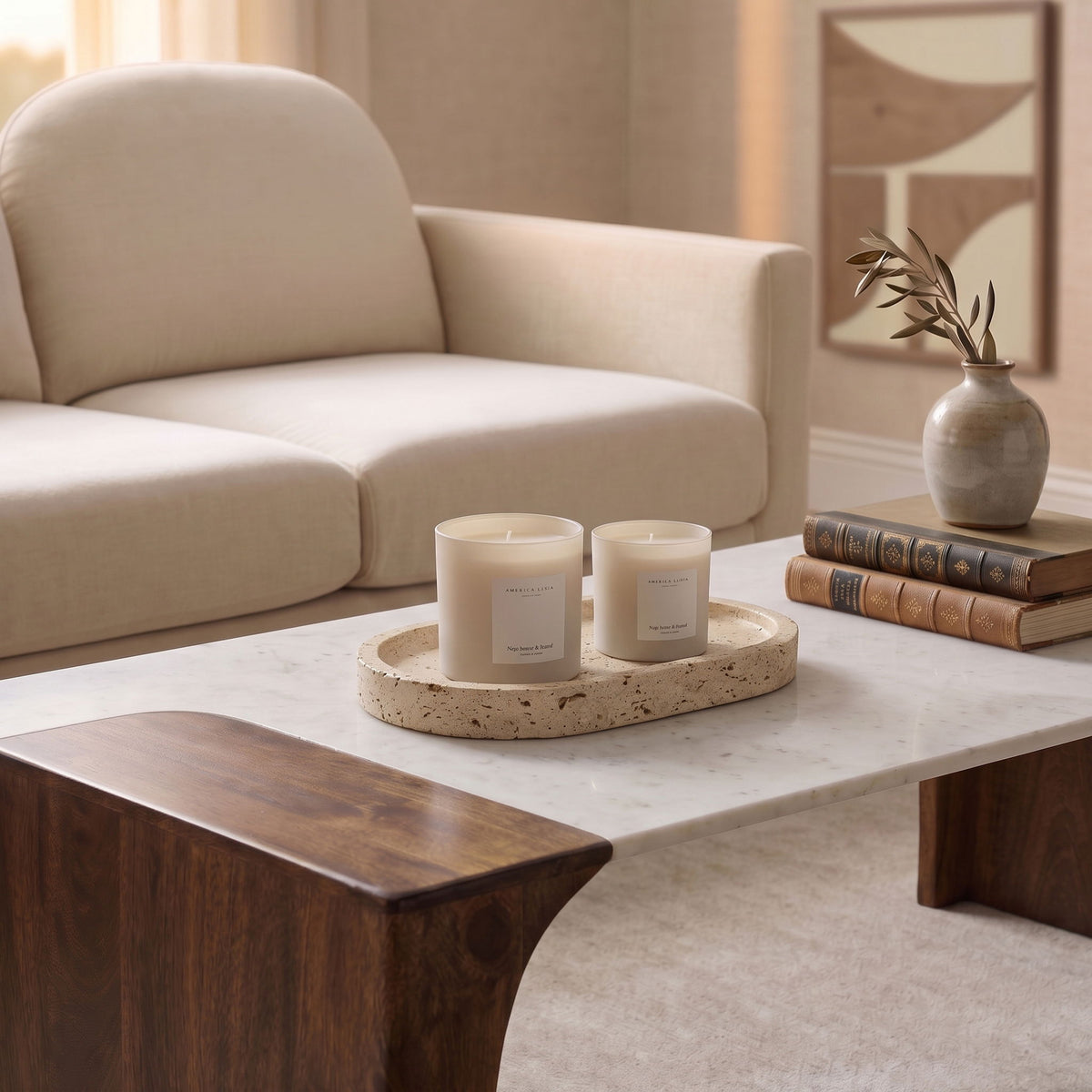 Beige round travertine tray with two candles on recessed surface