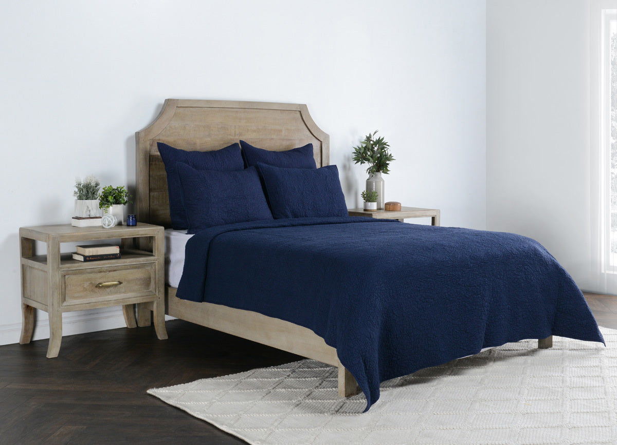 Indigo king sham cover on a made bed with matching pillows