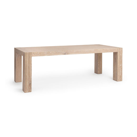 Rectangular dining table with light wood finish and straight legs