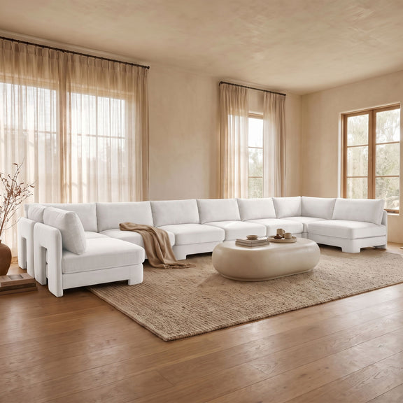 Beige velvet U-shaped armless sectional sofa with chaise and tufted seat cushions