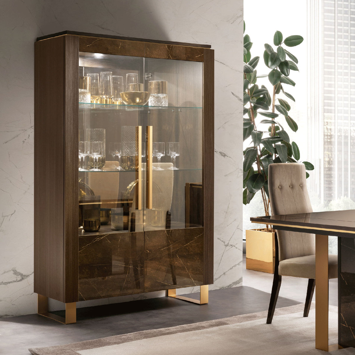 Dark brown 2-door glass china cabinet with shelves and visible glassware.