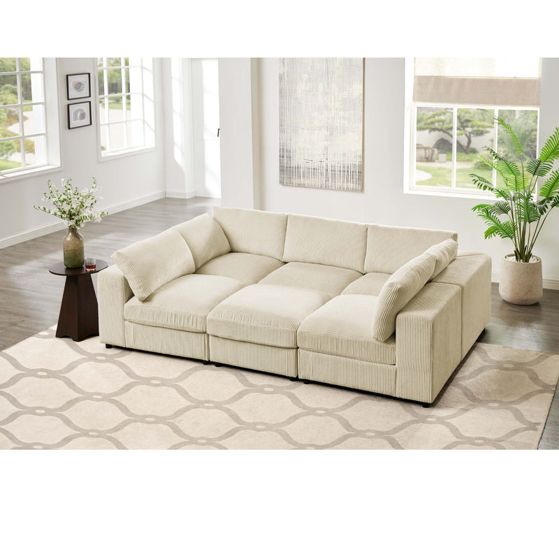 Light beige fabric sectional sofa with chaise ottoman style seats and rounded arms