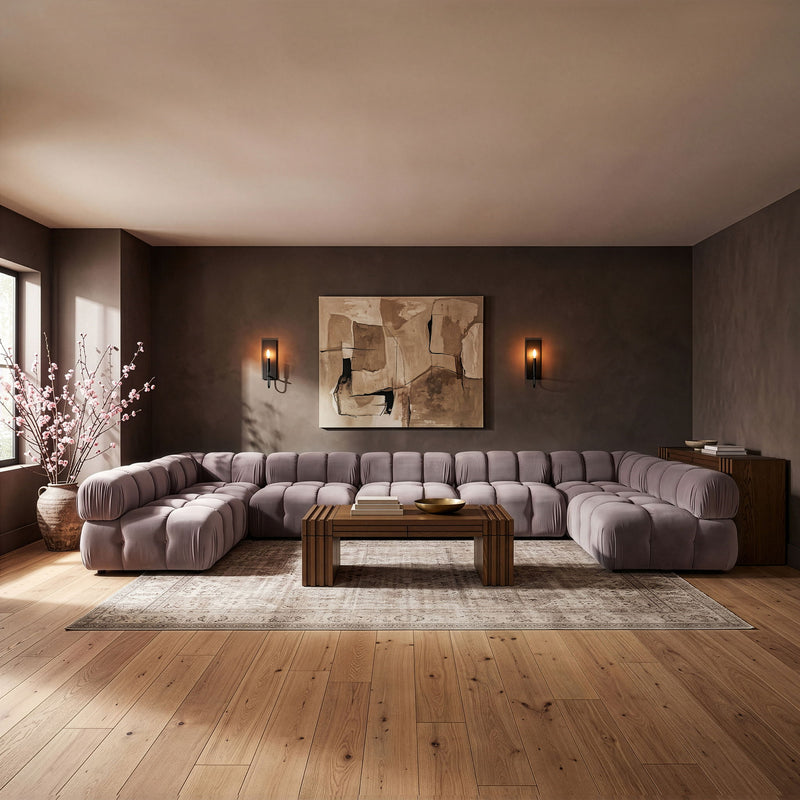 Gray U-shaped modular sectional sofa with tufted seats and back cushions