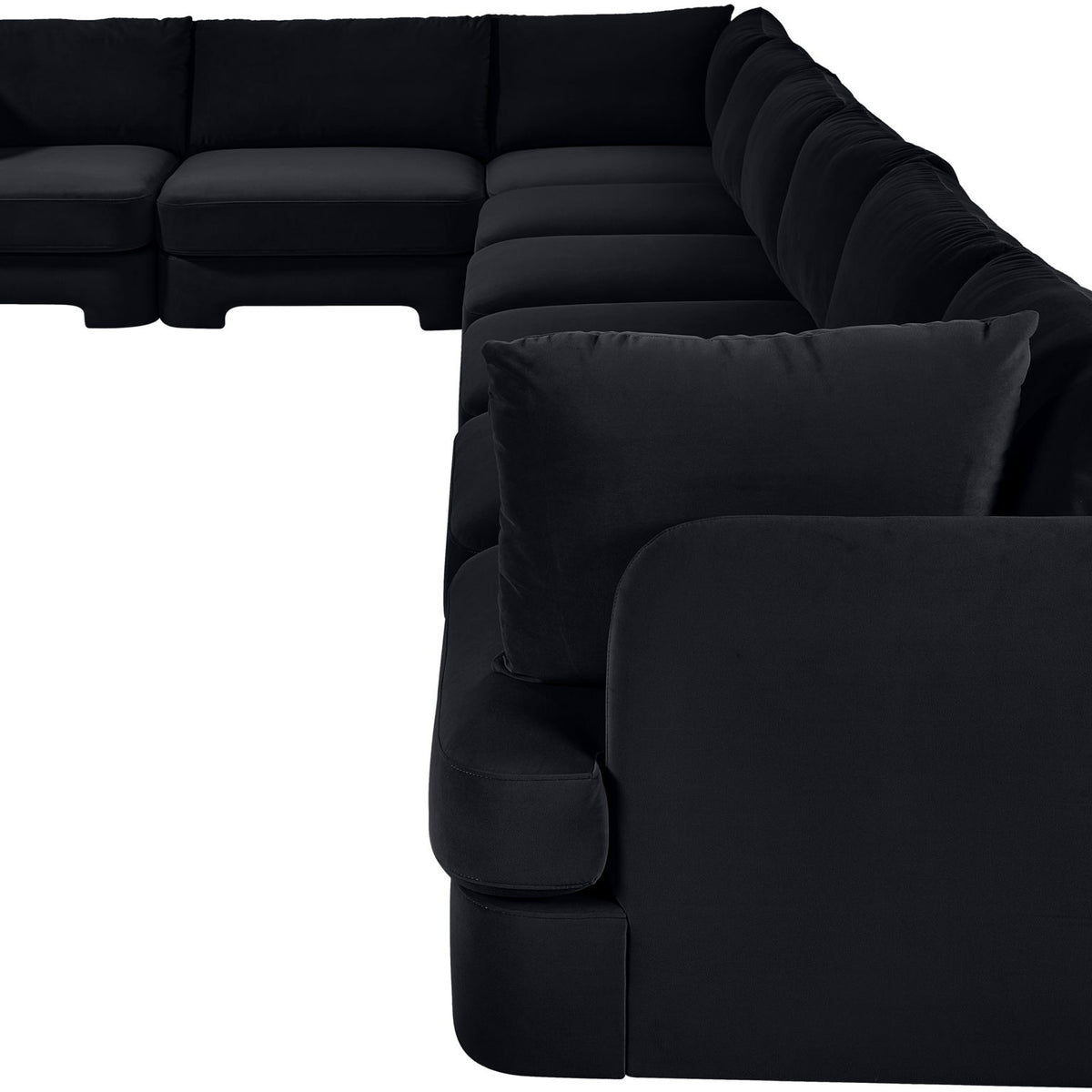 Black L-shaped velvet sectional sofa with deep chaise and padded armchair corner