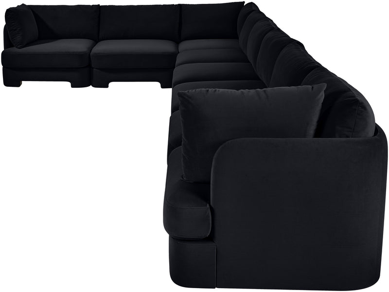 Black L-shaped velvet sectional sofa with deep chaise and padded armchair corner