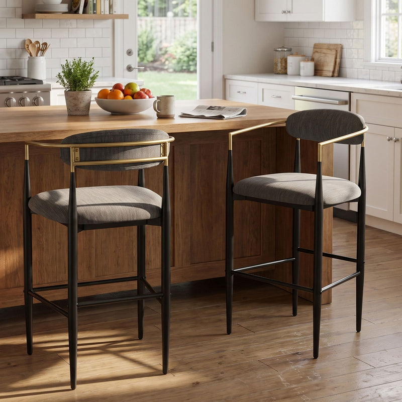 Pair of charcoal bar stools with padded seats, curved backs and black metal frames with gold-tone accents