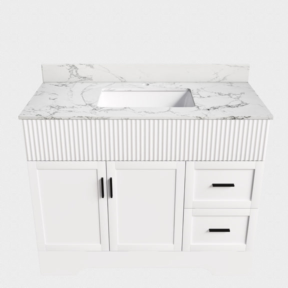White bathroom vanity cabinet with fluted front, sink, two doors and two drawers
