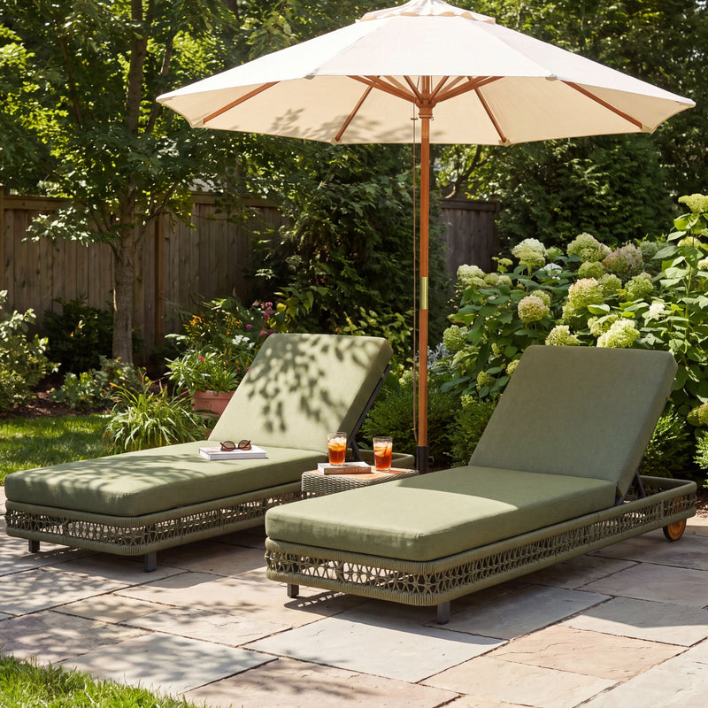 Two dark green outdoor chaise lounges with adjustable backrests and rolling wheels