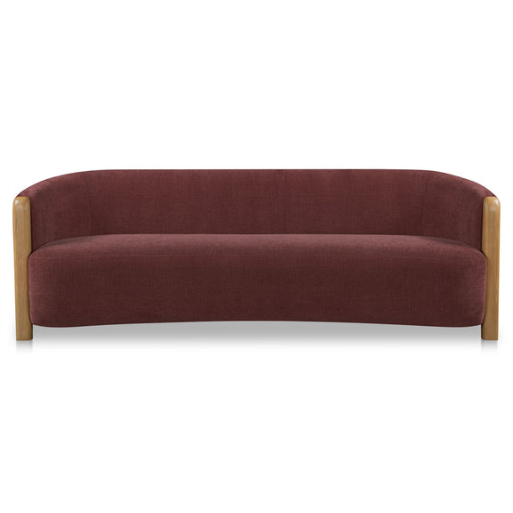 Berry purple upholstered 3-seat sofa with rounded arms and light wood frame