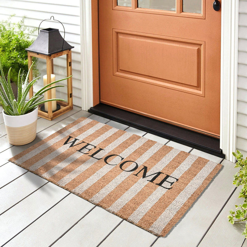 Striped welcome doormat with tan, white stripes and black 'WELCOME' text