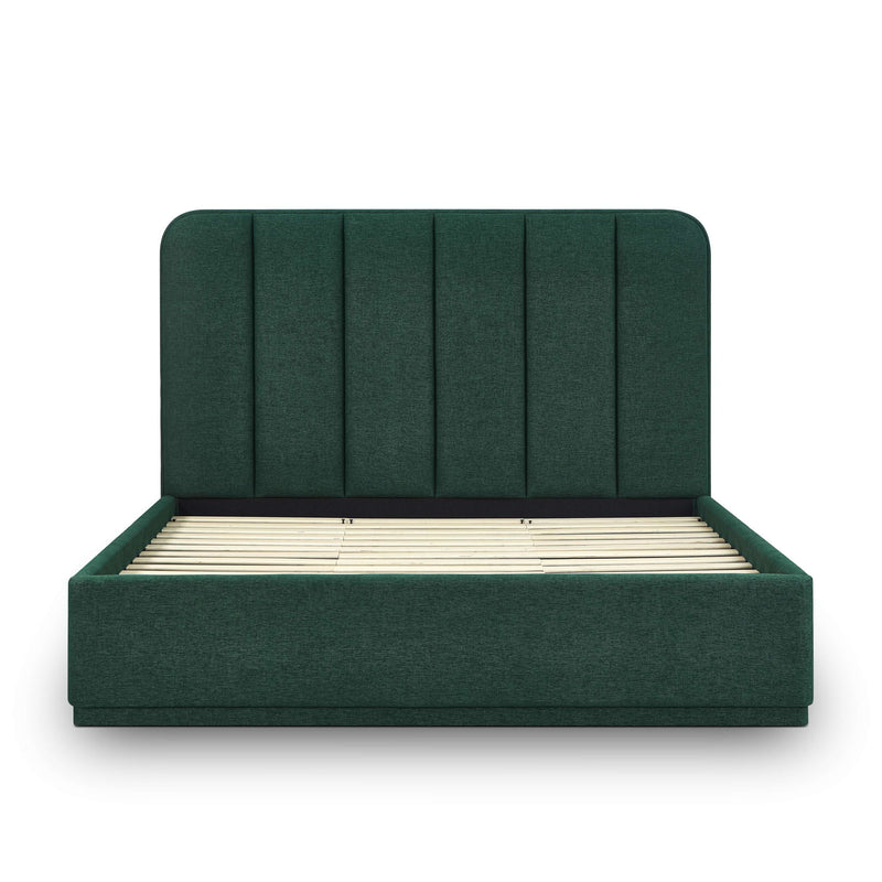 Dark green upholstered bed frame with slatted base and tufted vertical headboard.