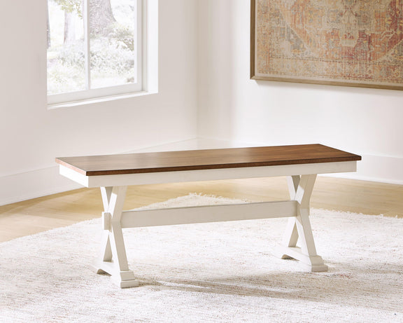 Dark brown wood dining bench with white trestle legs and underside shelf