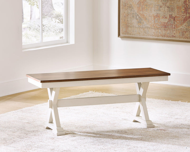 Dark brown wood dining bench with white trestle legs and underside shelf