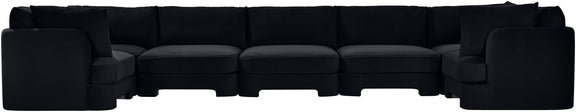 Black U-shaped sectional sofa, side view with boxy armrests and cushioned seating