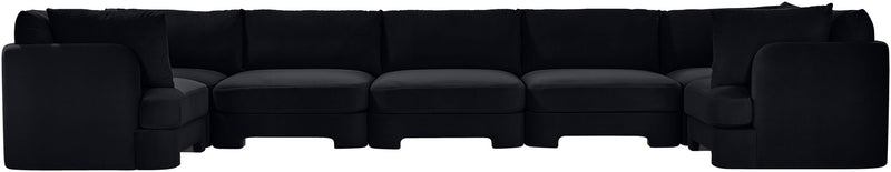 Black U-shaped sectional sofa, side view with boxy armrests and cushioned seating