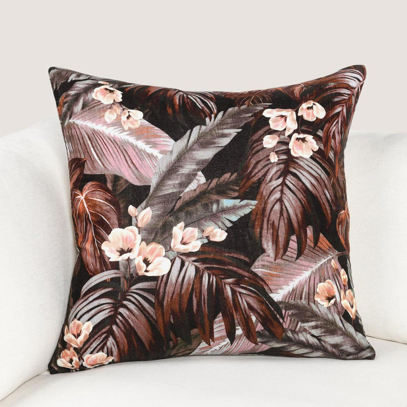 Brown tropical leaf and flower patterned square throw pillow with pink accents, 22x22"