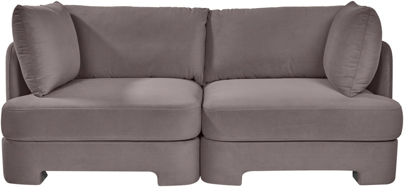 Slate gray velvet upholstered loveseat with rounded arms and two seat sections