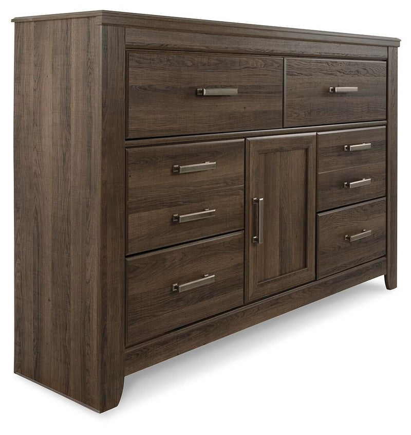 Dark brown wood dresser in side view with multiple drawers and silver bar pulls.