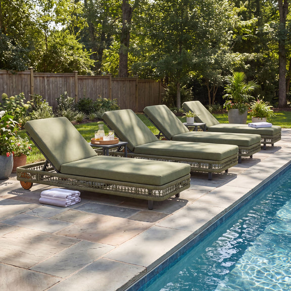 Set of four dark green outdoor chaise lounges with adjustable backrests and wheels