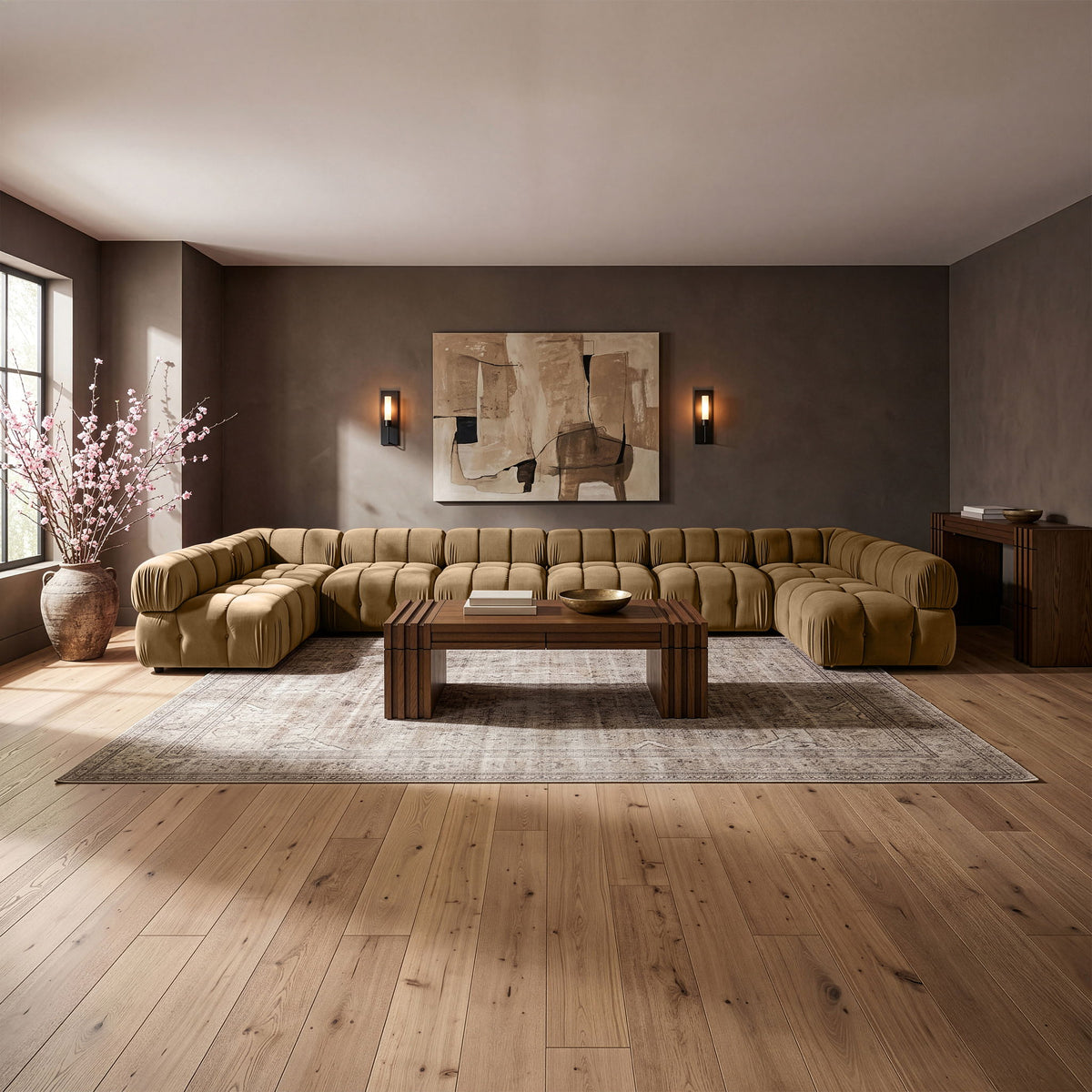 Beige modular sectional sofa with tufted cushions and curved chaise corner design