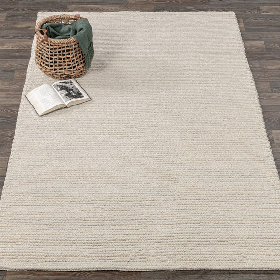 Dawson rug in light cream with dense braided texture and evenly spaced horizontal striations
