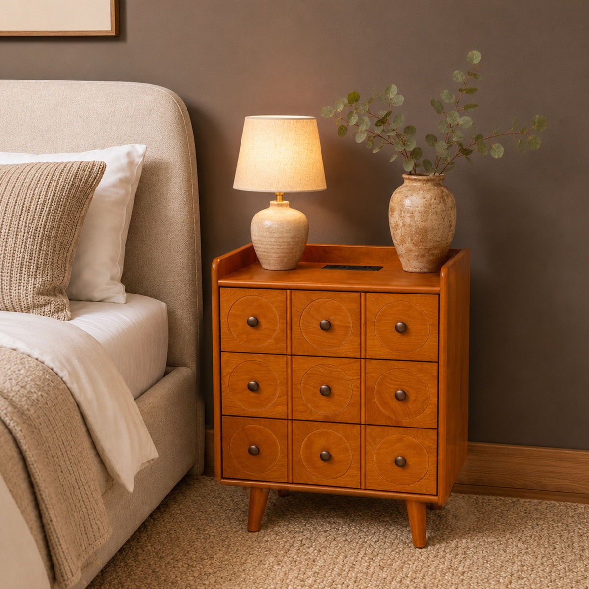 Natural wood end table with nine drawers, lamp on top