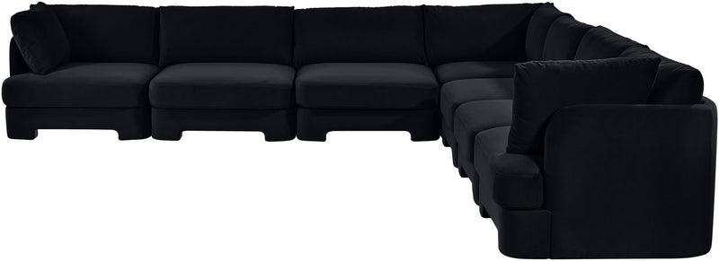 Black velvet corner sectional sofa with tufted cushions and right-side chaise
