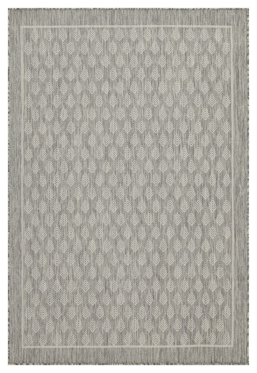 Indoor/outdoor polypropylene area rug, gray with repeating chevron pattern and fringe edge