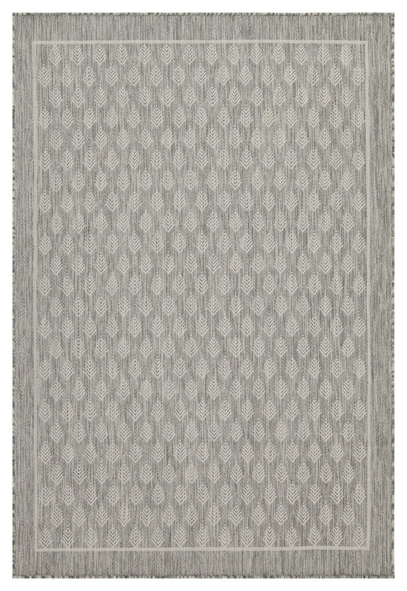 Gray area rug with repeating diamond pattern and short fringe along edge