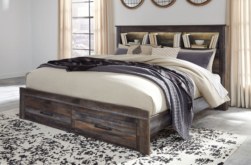 Panel bookcase bed in dark wood with two front drawers and beige-gray layered bedding