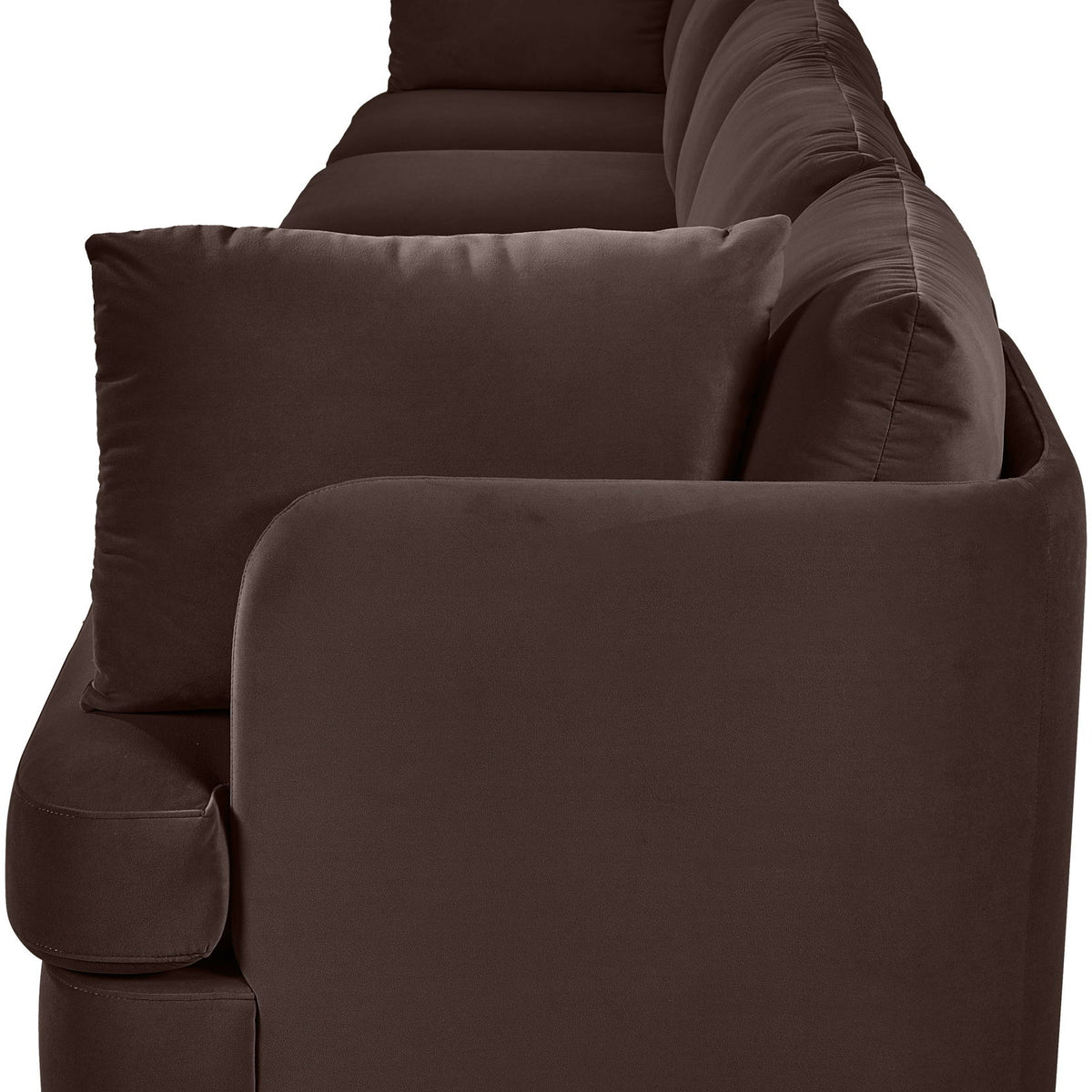 Dark brown velvet upholstered accent sofa chair with rounded arms and back pillows