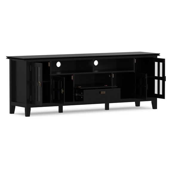 Black TV media stand with two open shelves and central drawer