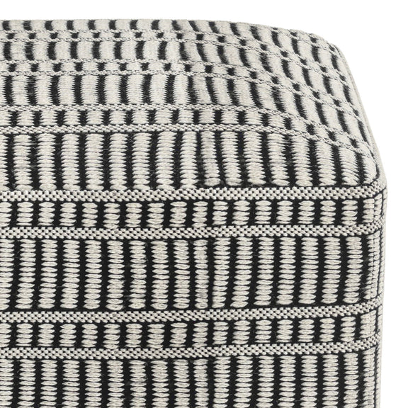 Close-up of the pouf's textured black and white woven pattern