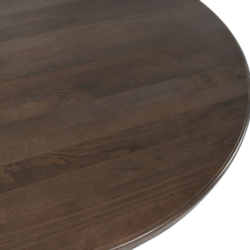 Dark brown round dining table, wood tabletop close-up