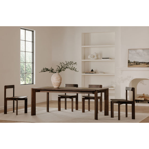 Walnut dining chairs with open square backs arranged around a dark table